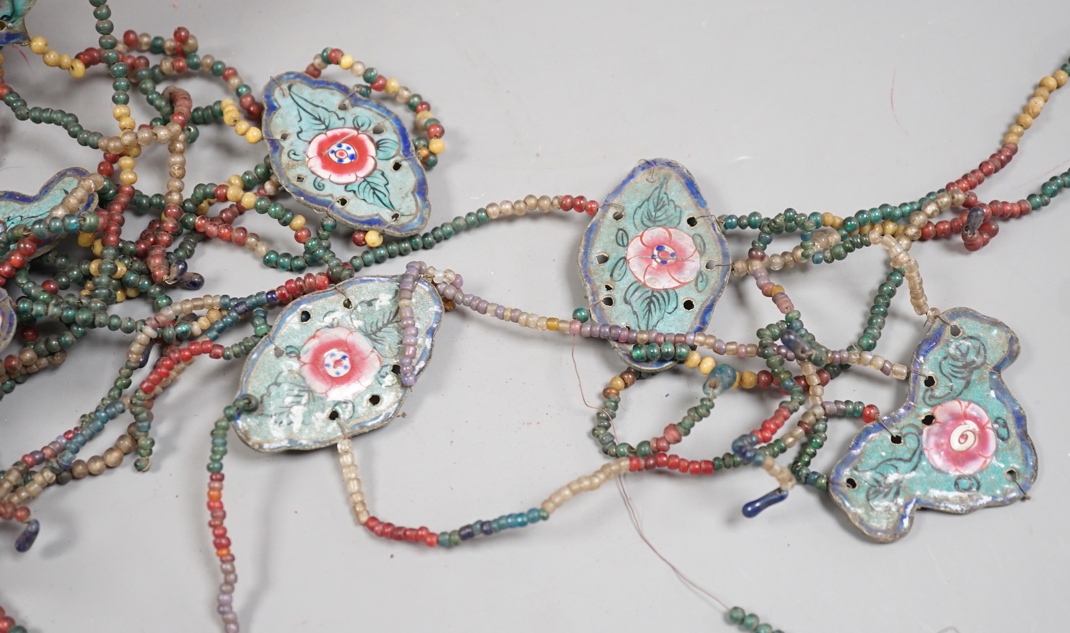 A group of Chinese enamel and glass bead hanging decorations, early 20th century